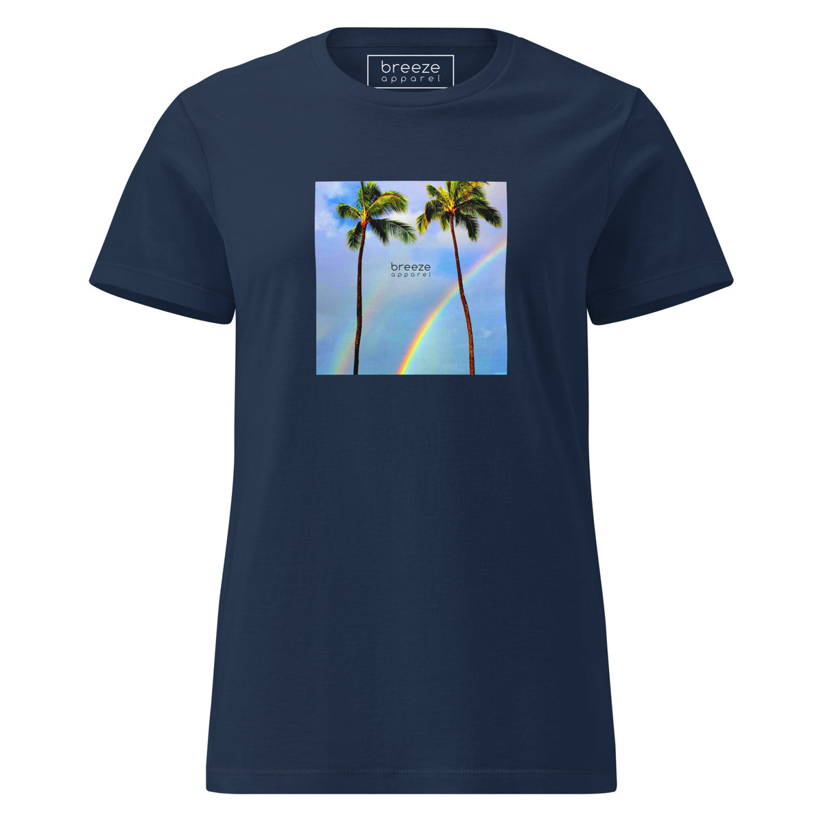 Navy t-shirt with a graphic of palm trees, rainbow, and a clear blue sky in the background. A small, black 'breeze apparel' logo is between the trees. 