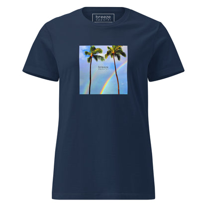 Navy t-shirt with a graphic of palm trees, rainbow, and a clear blue sky in the background. A small, black 'breeze apparel' logo is between the trees. 