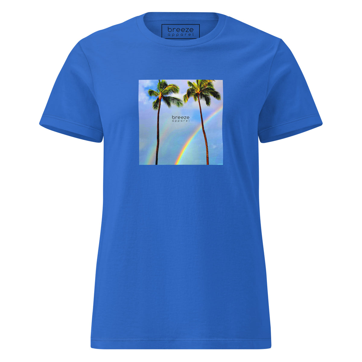 Royal-blue t-shirt with a graphic of palm trees, rainbow, and a clear blue sky in the background. A small, black 'breeze apparel' logo is between the trees. 