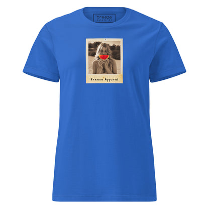Blue t-shirt with graphic of woman holding watermelon slice in front of her mouth.