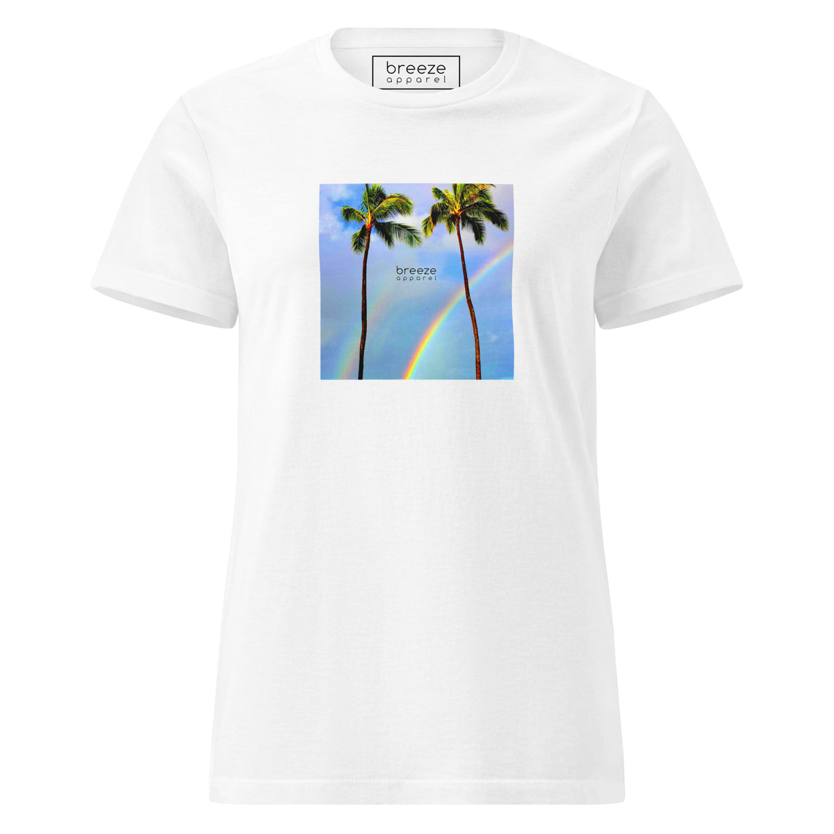 White t-shirt with a graphic of palm trees, rainbow, and a clear blue sky in the background. A small, black 'breeze apparel' logo is between the trees. 
