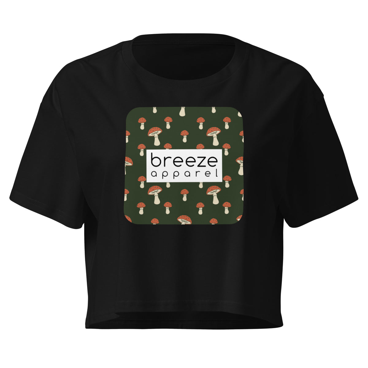Black crop top with graphic of mushrooms set on a green background and overlaid with a white rectangle logo.