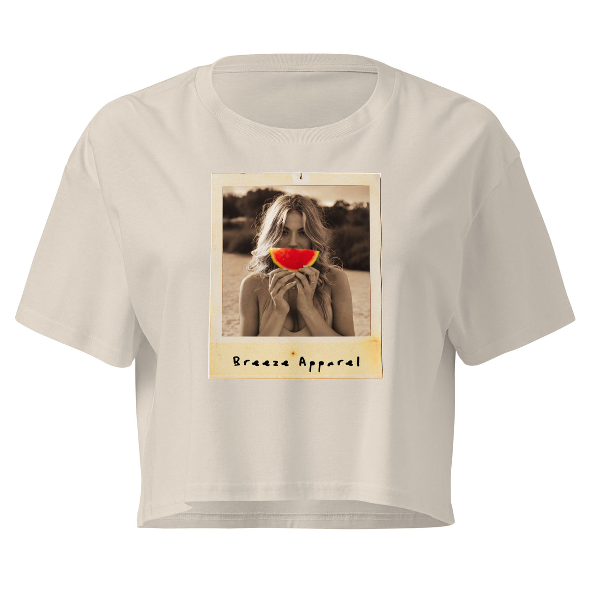 Cream crop top with graphic of woman holding piece of watermelon in front of her mouth.