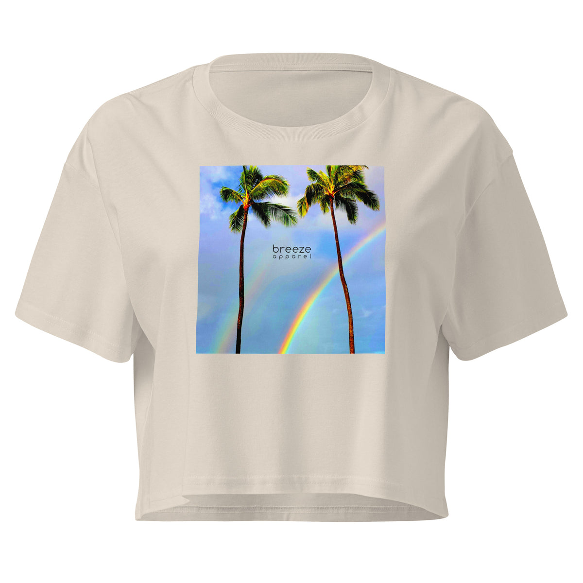Cream crop top with graphic of palm trees and a rainbow.