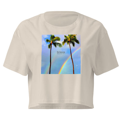 Cream crop top with graphic of palm trees and a rainbow.