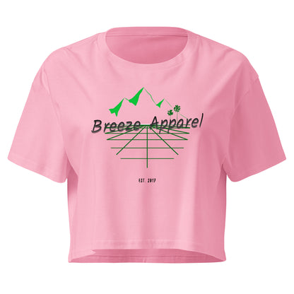 Pink crop top with graphic of palm trees and mountains.