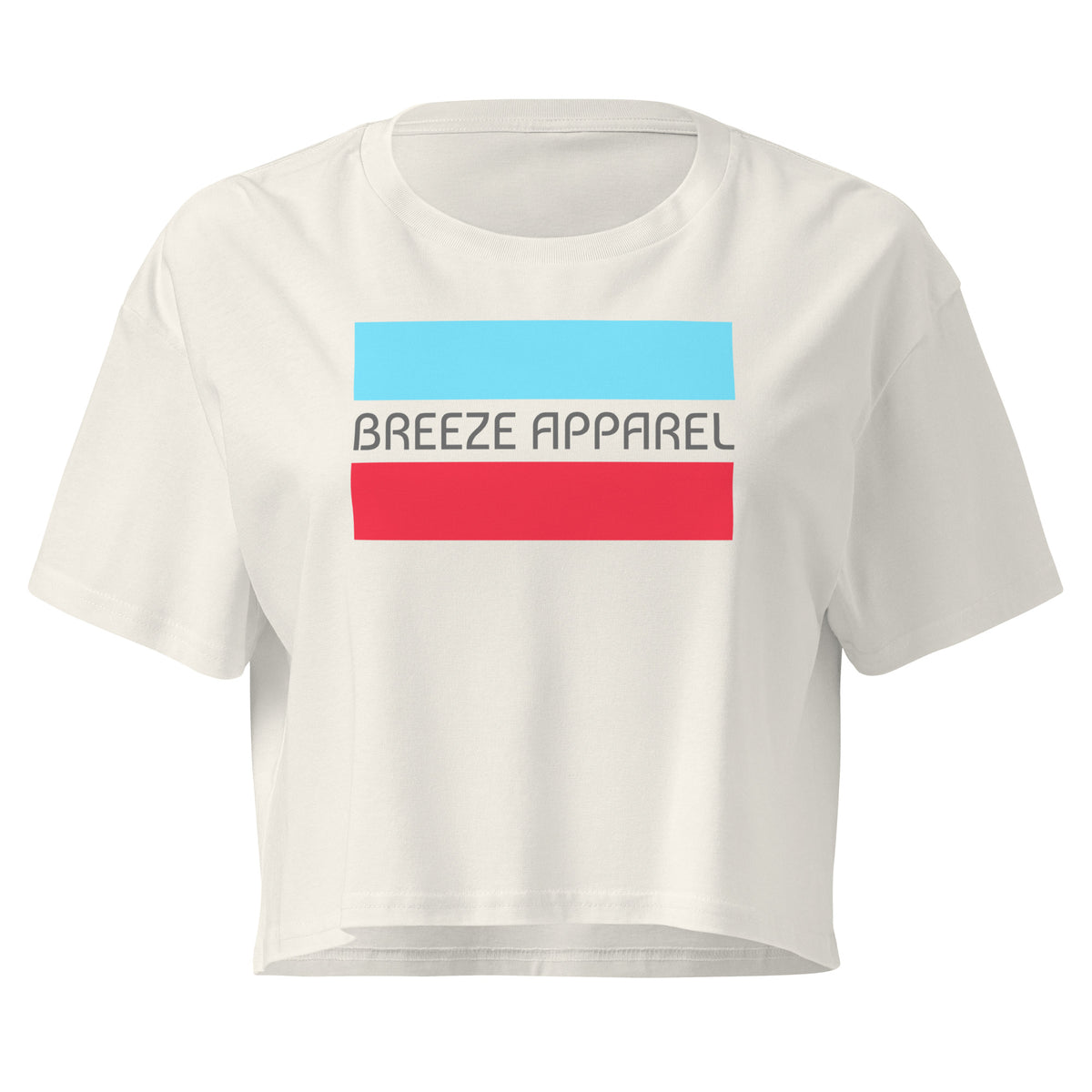 Cream crop top with graphic of gray lettering between blue and red horizontal bars.