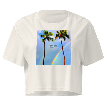Cream crop top with graphic of palm trees and a rainbow.