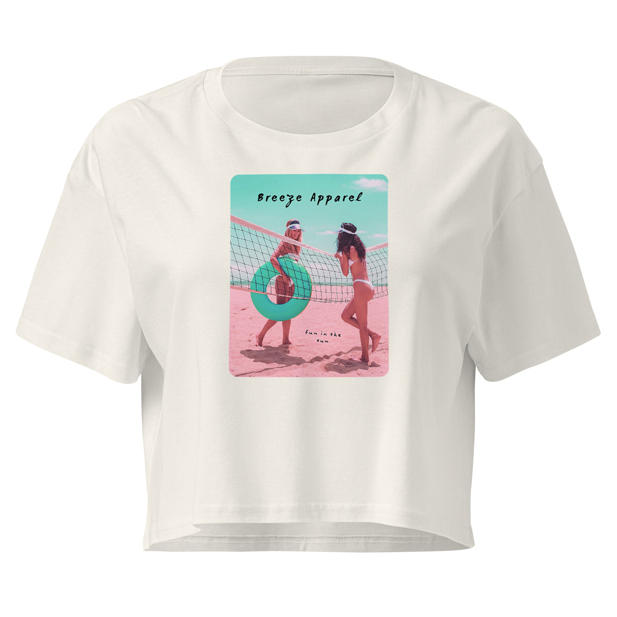 Cream crop top with graphic of two women in bikinis talking on the beach.