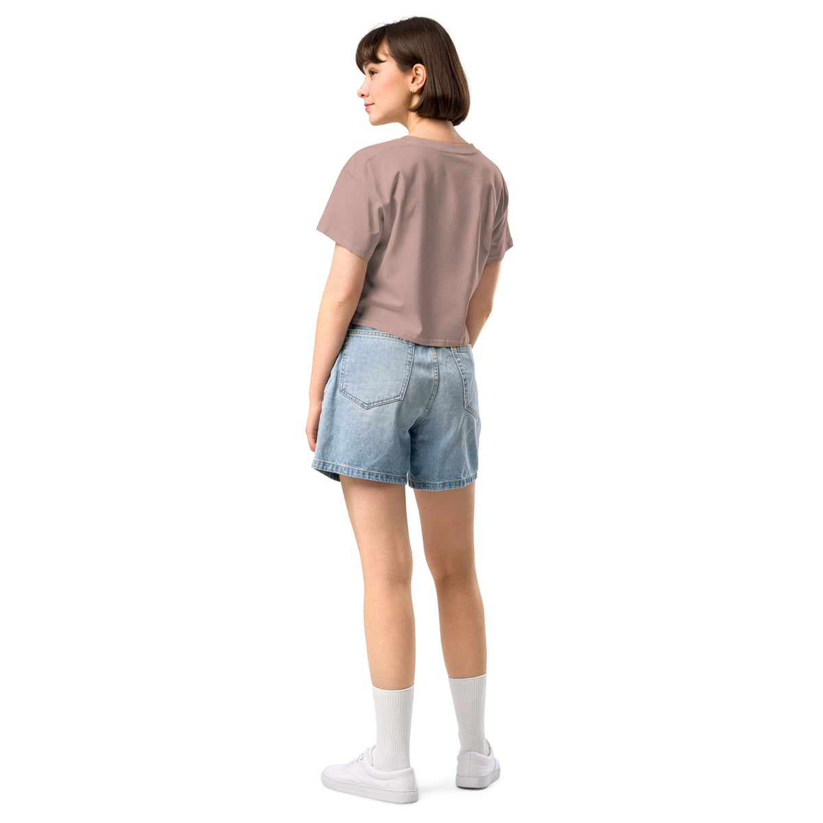 Rear view of woman wearing pink crop top.