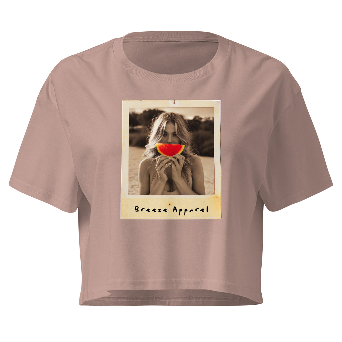 Pink crop top with graphic of woman holding piece of watermelon in front of her mouth.