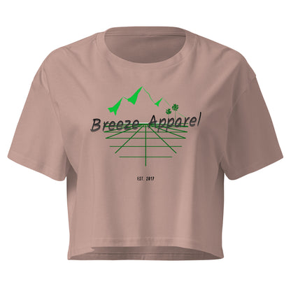 Mauve crop top with graphic of palm trees and mountains.