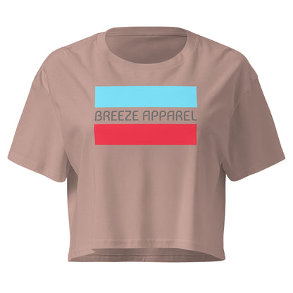 Mauve crop top with graphic of gray lettering between blue and red horizontal bars.