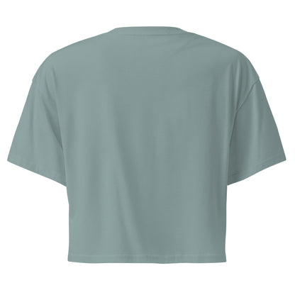 Plain back of green crop top.