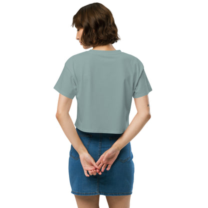 Rear view of woman wearing green crop top.