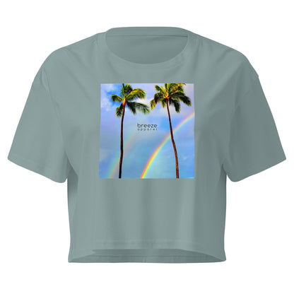 Green crop top with graphic of palm trees and a rainbow.