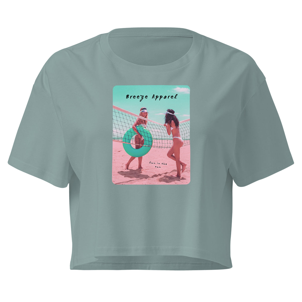 Green crop top with graphic of two women in bikinis talking on the beach.