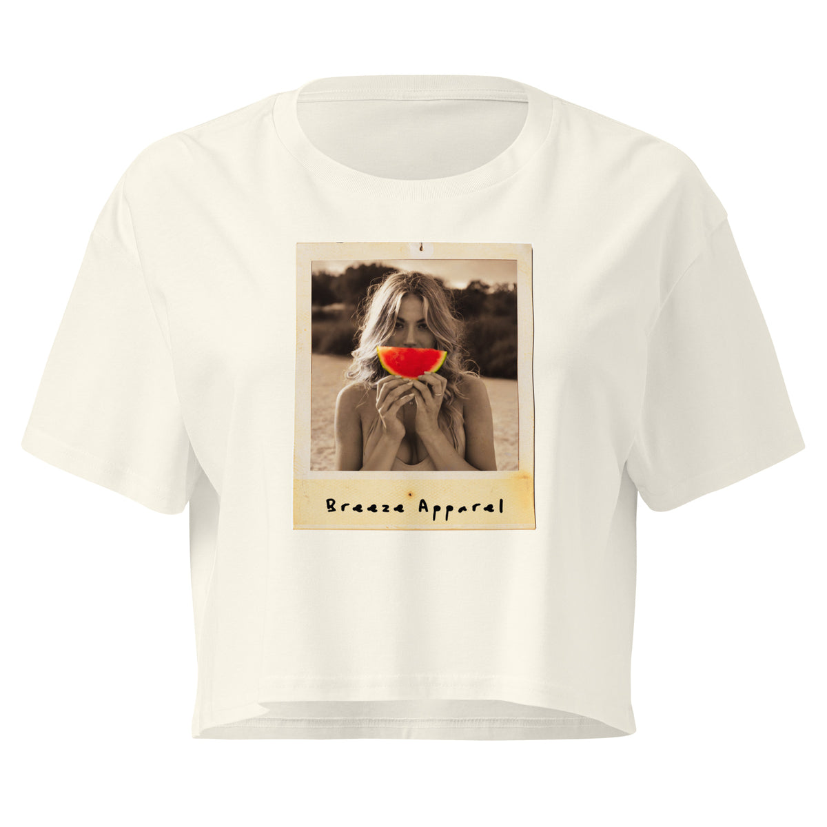 Cream crop top with graphic of woman holding piece of watermelon in front of her mouth.