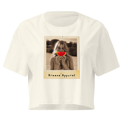 Cream crop top with graphic of woman holding piece of watermelon in front of her mouth.
