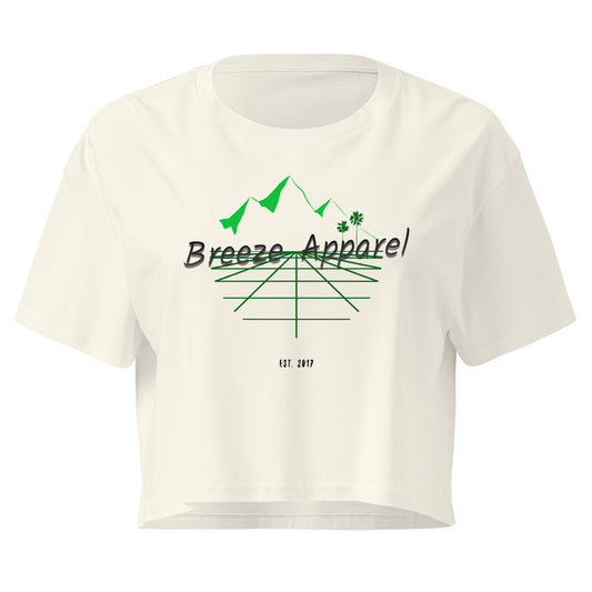 Cream crop top with graphic of palm trees and mountains.