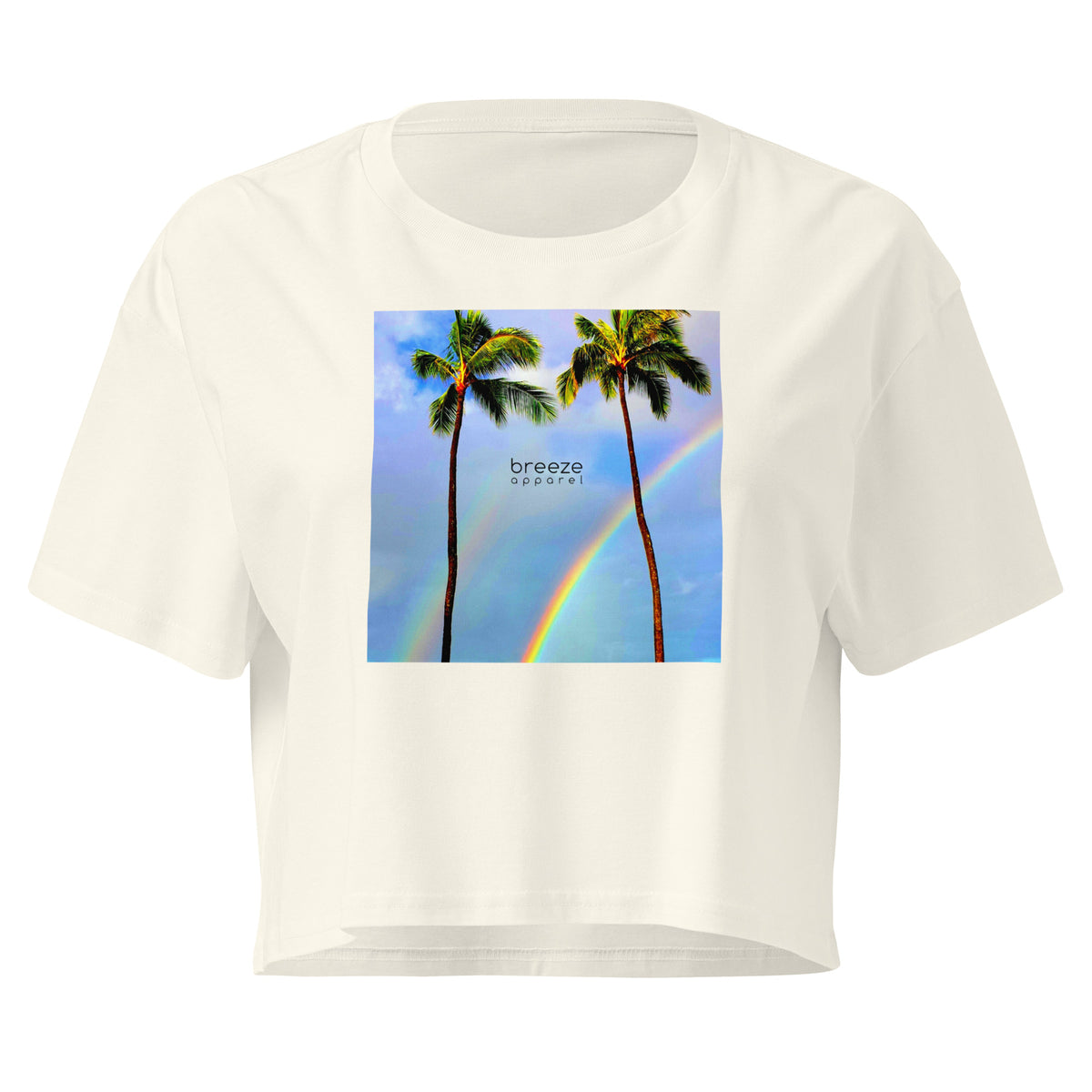Cream crop top with graphic of palm trees and a rainbow.