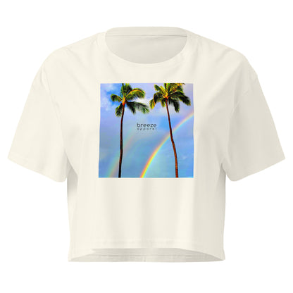 Cream crop top with graphic of palm trees and a rainbow.