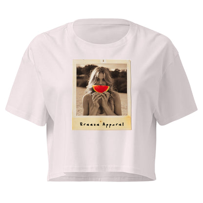 Orchid crop top with graphic of woman holding piece of watermelon in front of her mouth.