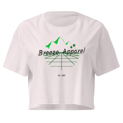 Orchid crop top with graphic of palm trees and mountains.
