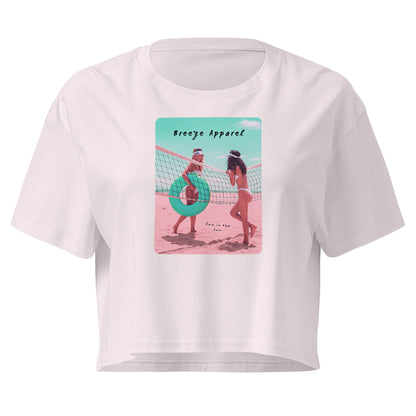 Orchid crop top with graphic of two women in bikinis talking on the beach.