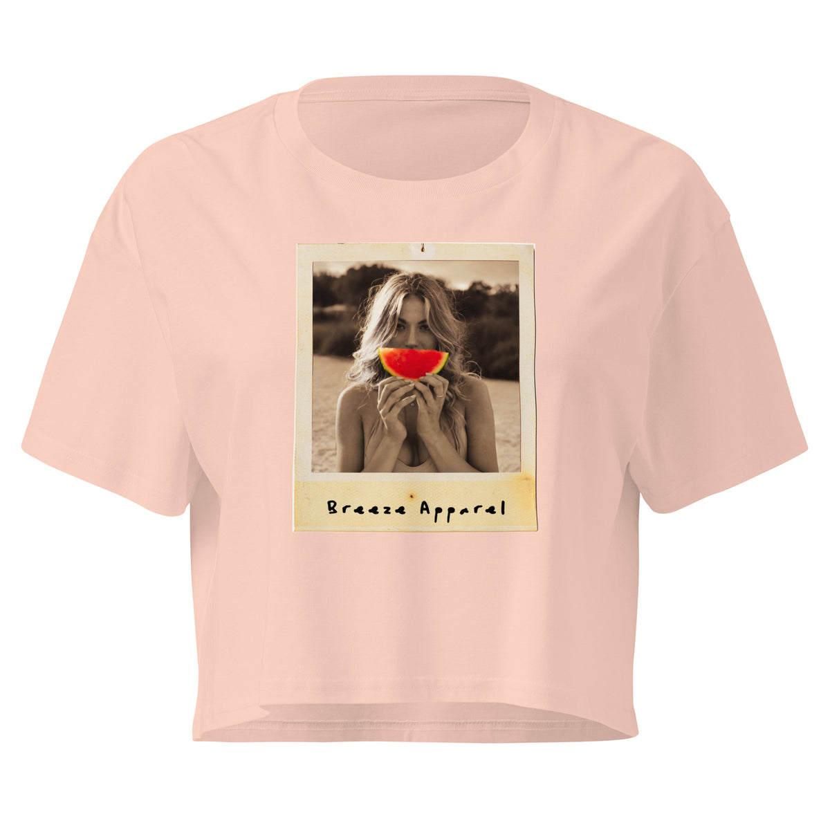 Pink crop top with graphic of woman holding piece of watermelon in front of her mouth.