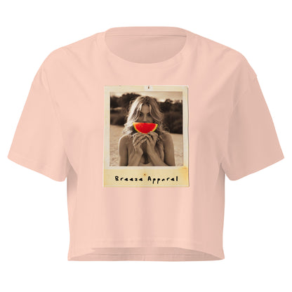 Pink crop top with graphic of woman holding piece of watermelon in front of her mouth.
