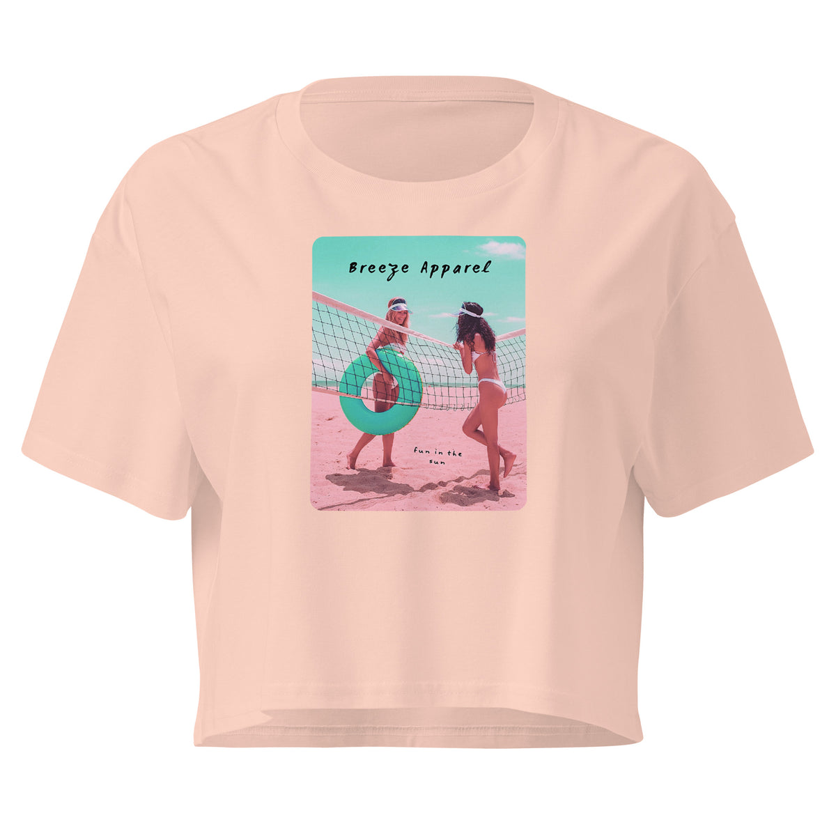 Pink crop top with graphic of two women in bikinis talking on the beach.