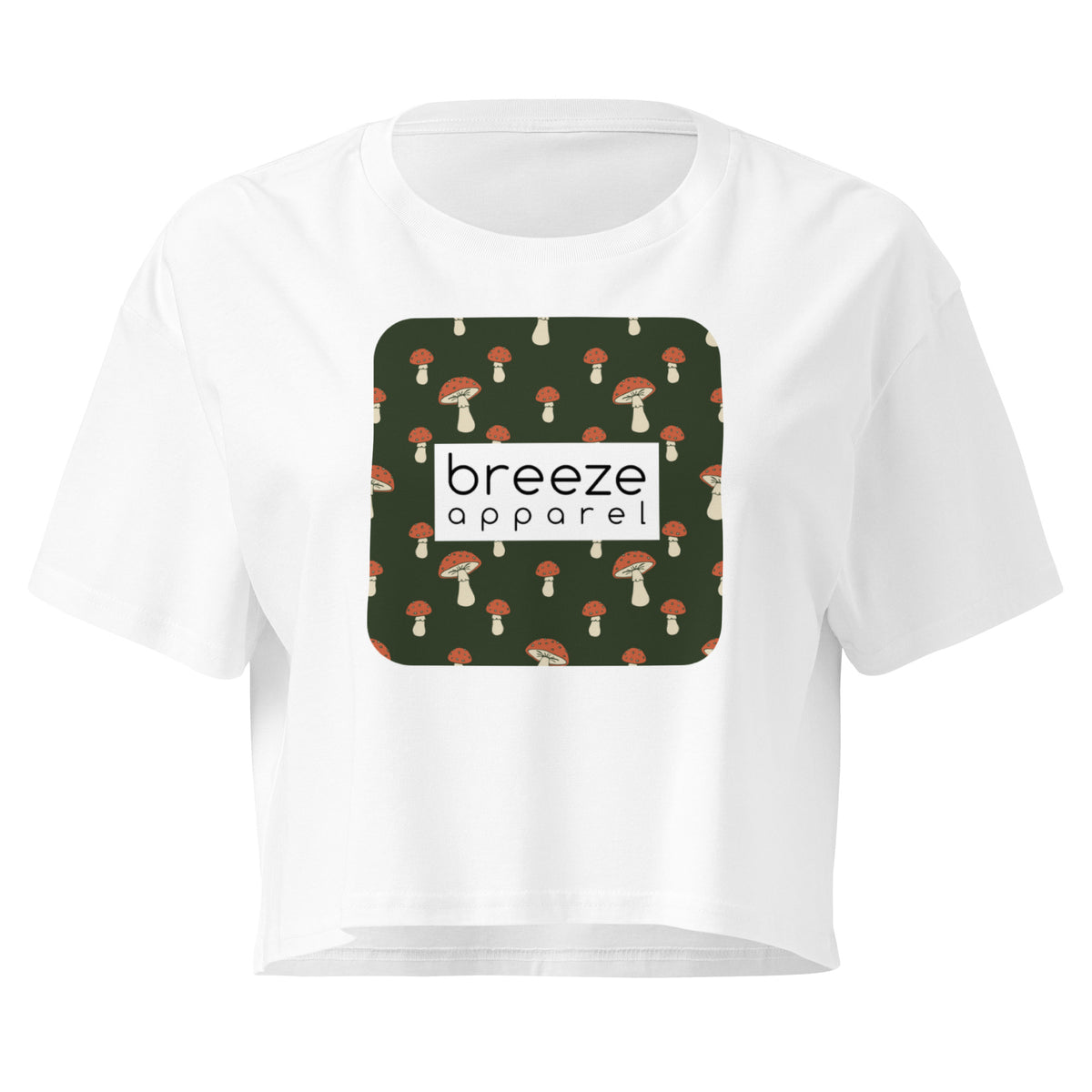 White crop top with graphic of mushrooms set on a green background and overlaid with a white rectangle logo.