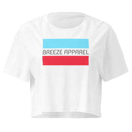 White crop top with graphic of gray lettering between blue and red horizontal bars.