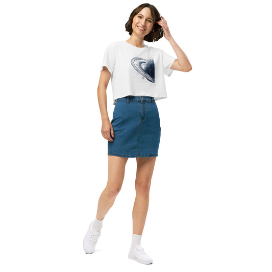 Woman wearing white crop top with graphic of blue planet.