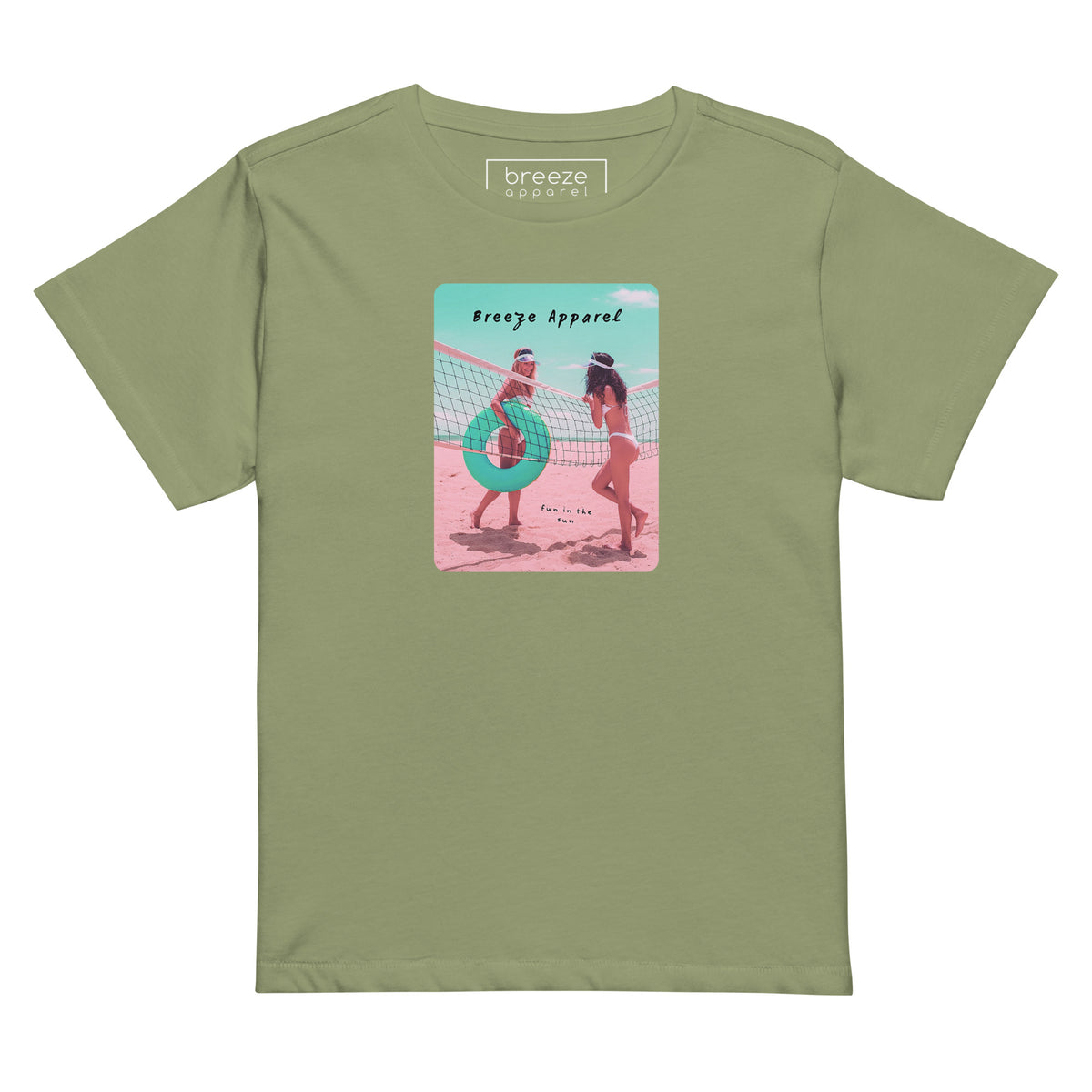 Artichoke-green t-shirt with an image of two women in bikinis on the beach, standing by a volleyball net, one holding a swim ring and smiling, the other leaning on the net, with inscription in black of 'breeze apparel' towards the top of the image, and 'fun in the sun' in black on the ground between the women. 