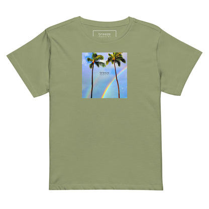 Artichoke-green t-shirt with a graphic of palm trees, rainbow, and a clear blue sky in the background. A small, black 'breeze apparel' logo is between the trees.