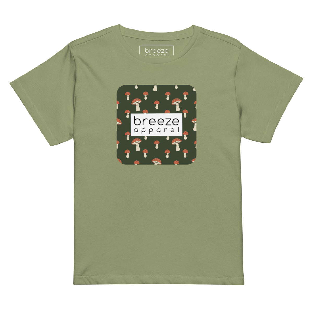 Light-green t-shirt with design of mushrooms set on green background and overlaid with a white rectangle with 'breeze apparel' in black inside.