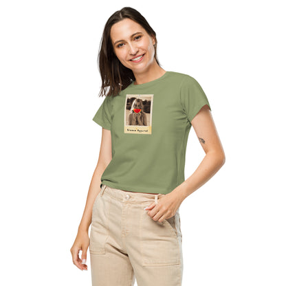 Woman wearing light-green t-shirt with graphic of woman holding a watermelon slice in front of her mouth.