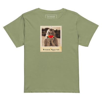 Light-green t-shirt with graphic of woman holding a watermelon slice in front of her mouth.