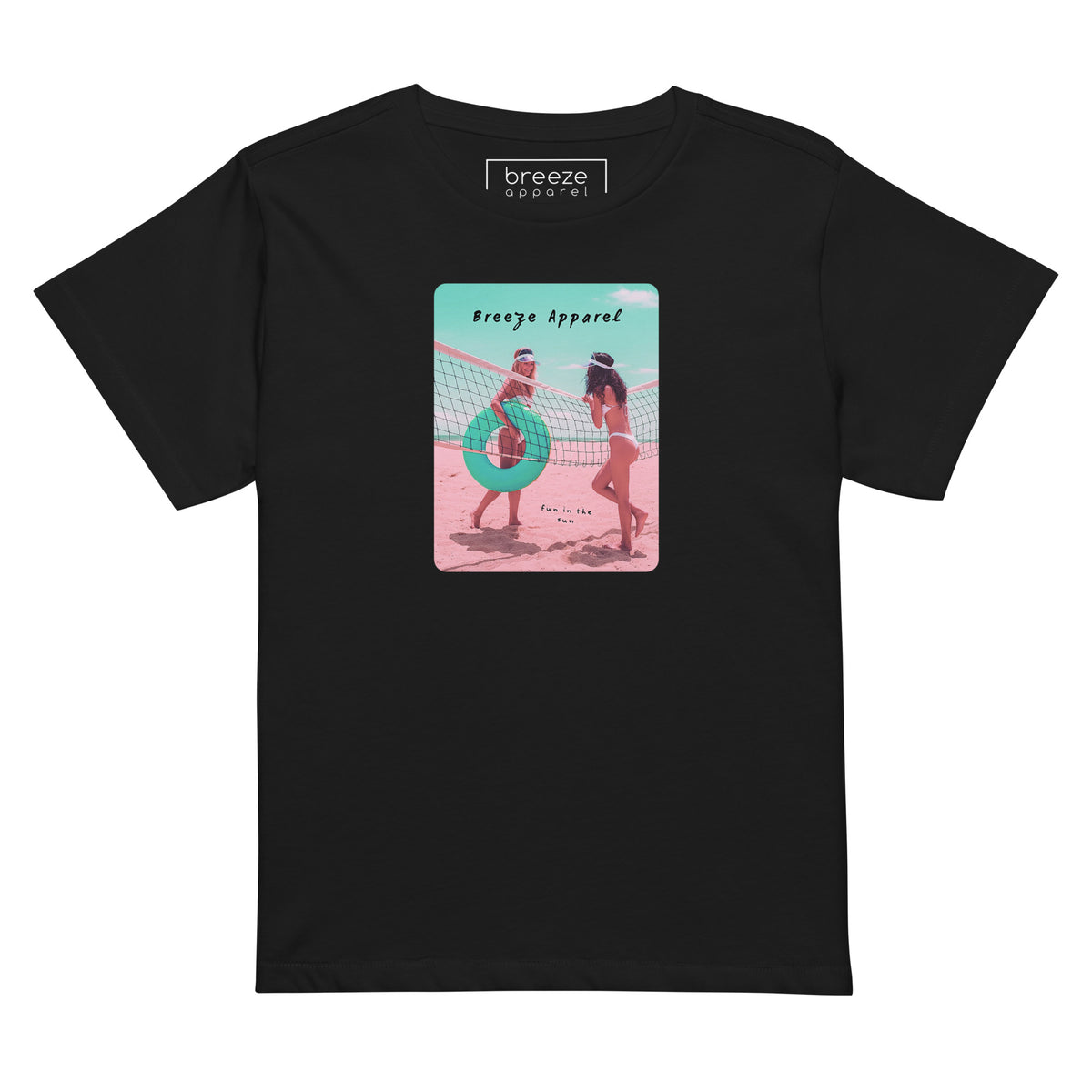 Black t-shirt with an image of two women in bikinis on the beach, standing by a volleyball net, one holding a swim ring and smiling, the other leaning on the net, with inscription in black of 'breeze apparel' towards the top of the image, and 'fun in the sun' in black on the ground between the women. 