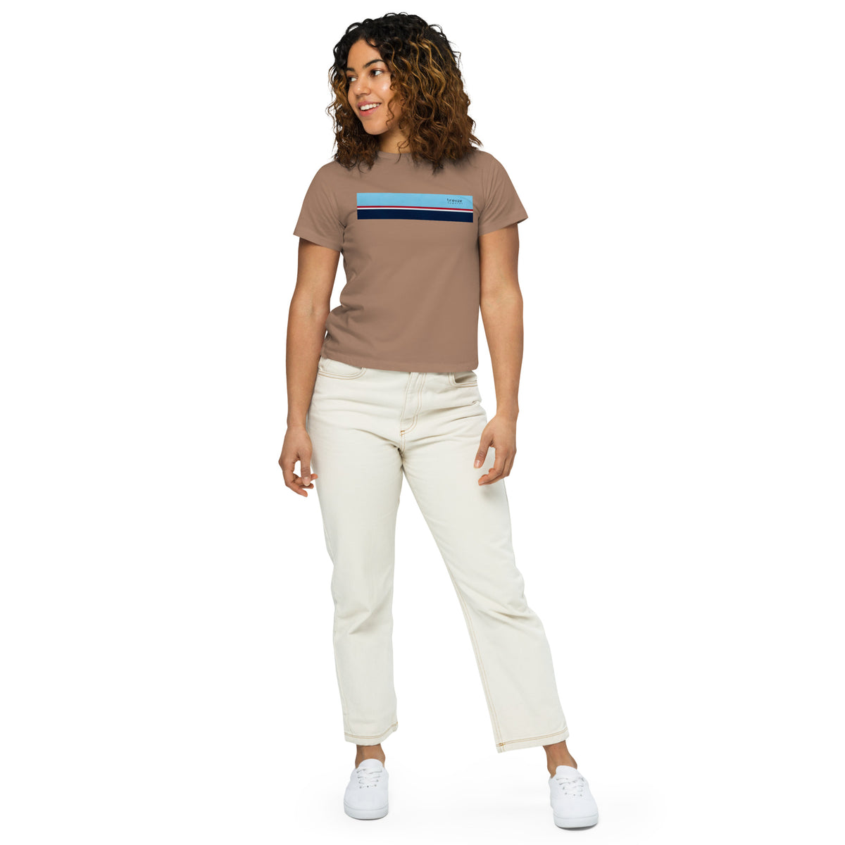 Woman wearing latte-brown t-shirt with horizontal blue, red, white, and navy stripe with small black 'breeze apparel' logo.