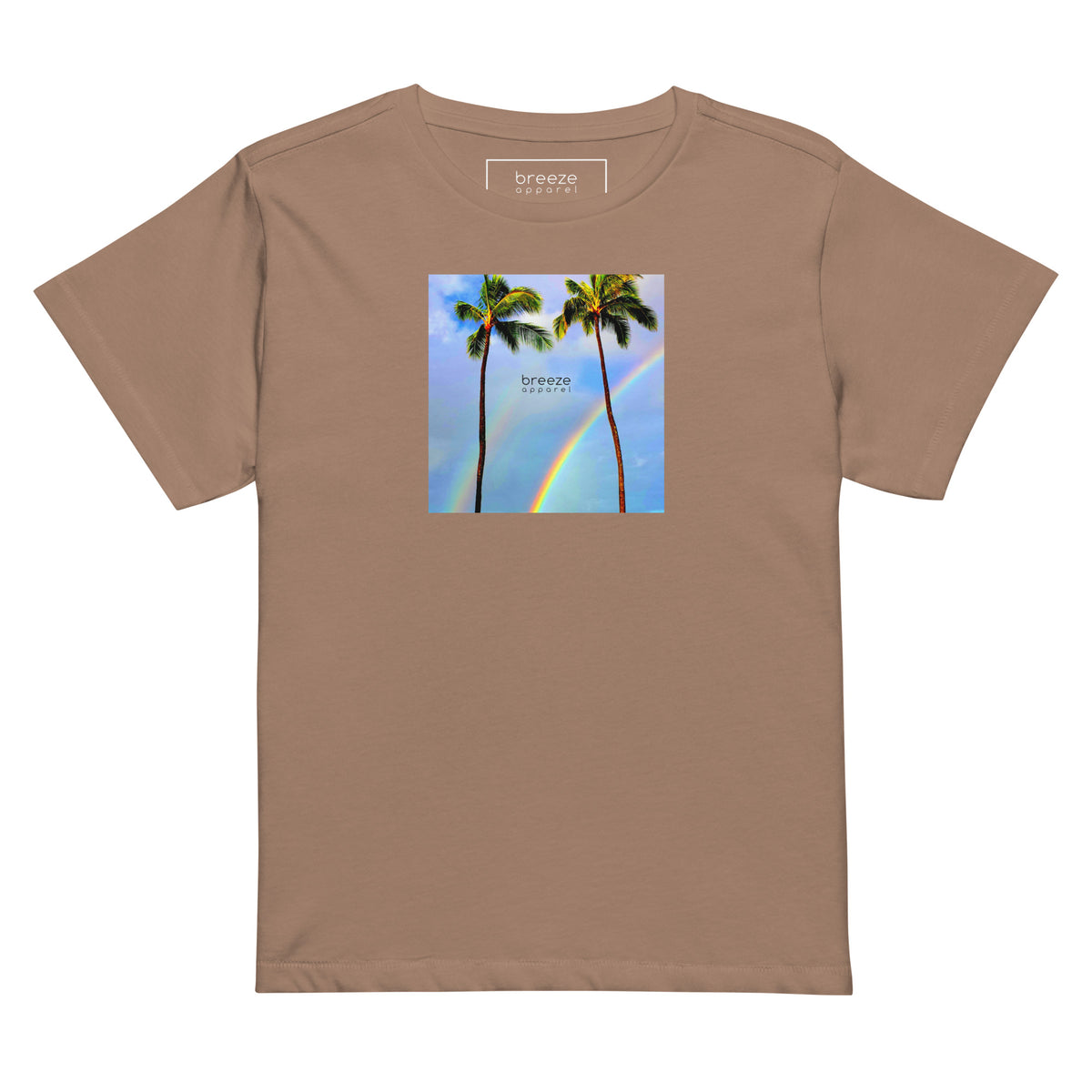 Latte-brown t-shirt with a graphic of palm trees, rainbow, and a clear blue sky in the background. A small, black 'breeze apparel' logo is between the trees.