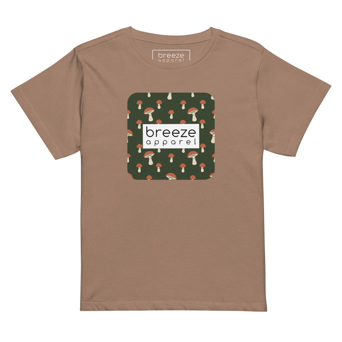 Brown t-shirt with design of mushrooms set on green background and overlaid with a white rectangle with 'breeze apparel' in black inside.