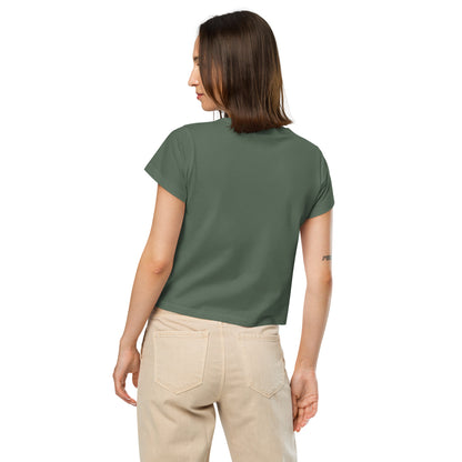 Rear view of woman wearing green t-shirt.