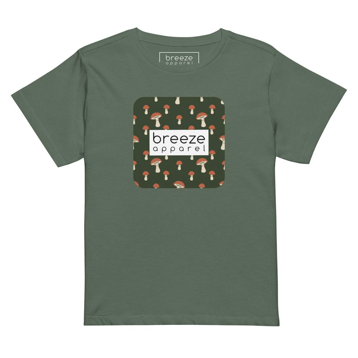 Pine-green t-shirt with design of mushrooms set on green background and overlaid with a white rectangle with 'breeze apparel' in black inside.