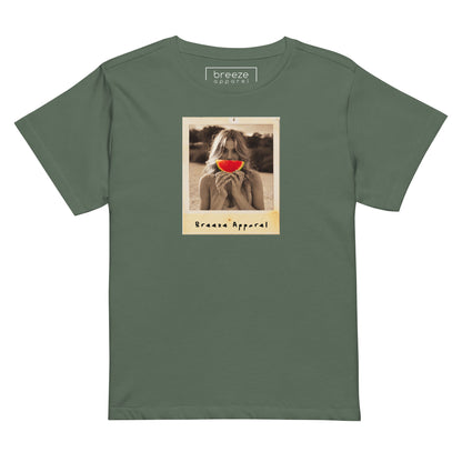 Pine-green t-shirt with graphic of woman holding a watermelon slice in front of her mouth.