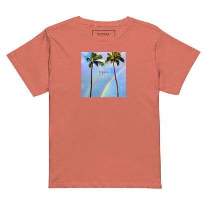 Red-sorbet t-shirt with a graphic of palm trees, rainbow, and a clear blue sky in the background. A small, black 'breeze apparel' logo is between the trees.