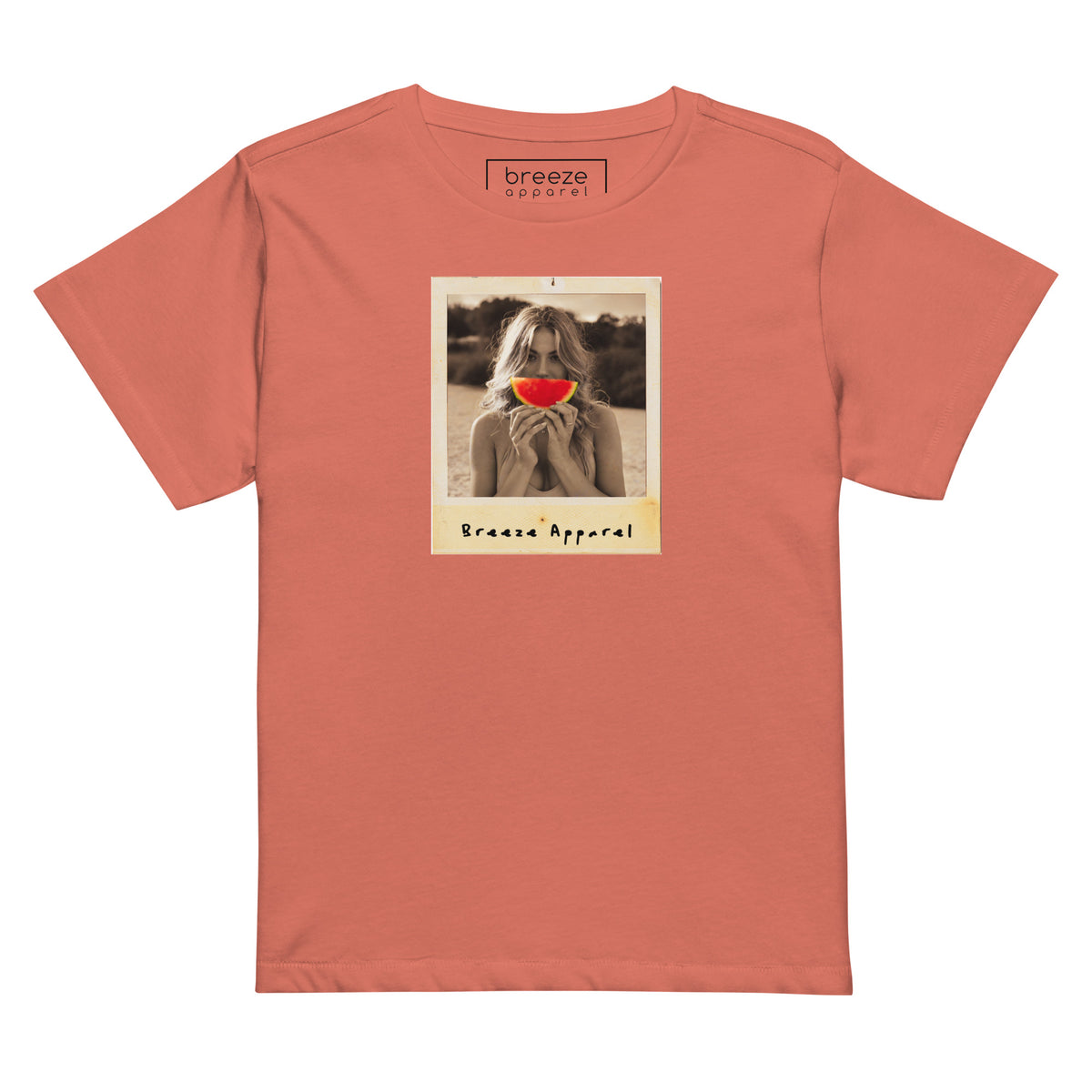 Orange t-shirt with graphic of woman holding a watermelon slice in front of her mouth.