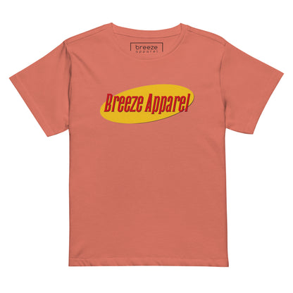 Orange t-shirt with red lettering over yellow oval.